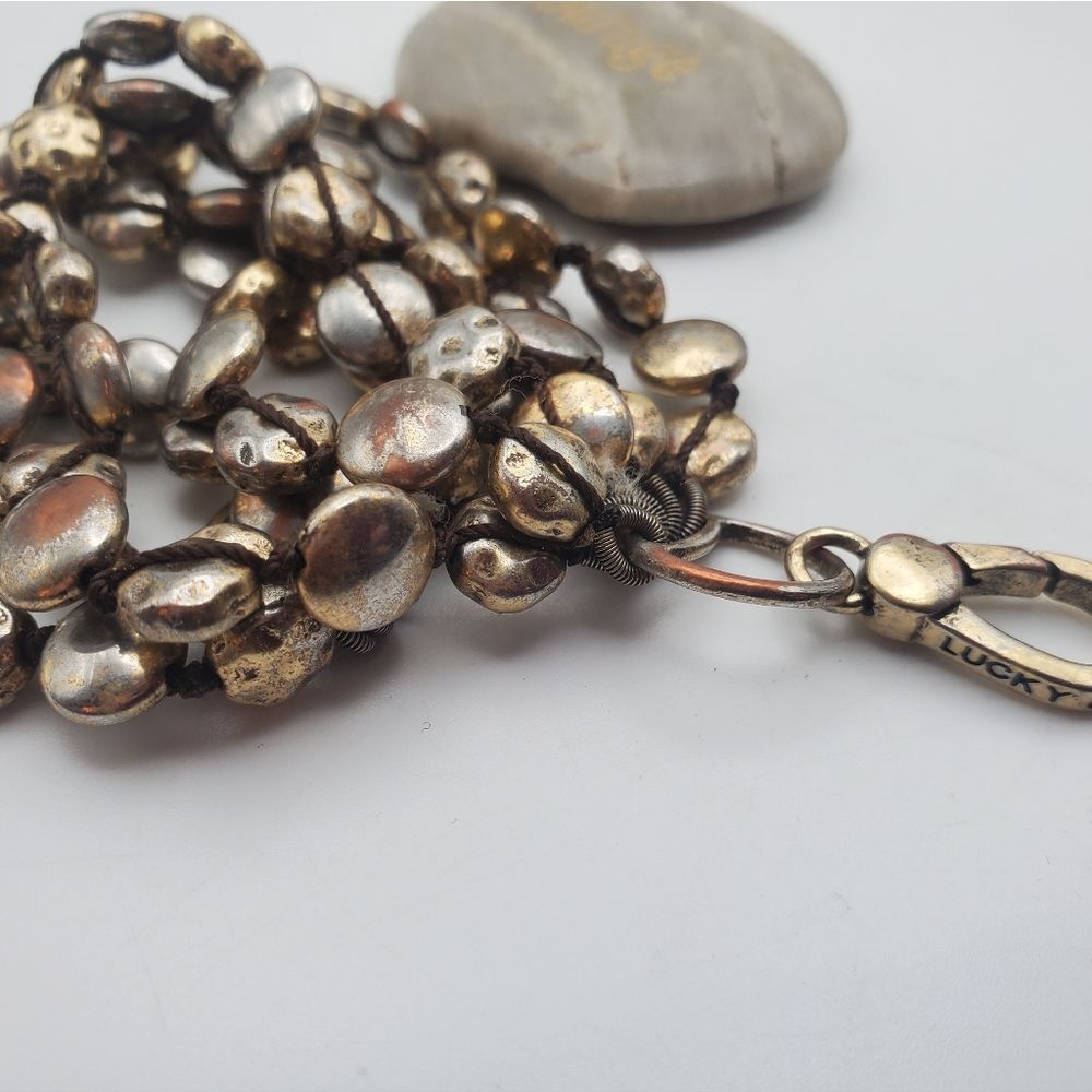 Lucky brand pebble gold toned champagne bracelet